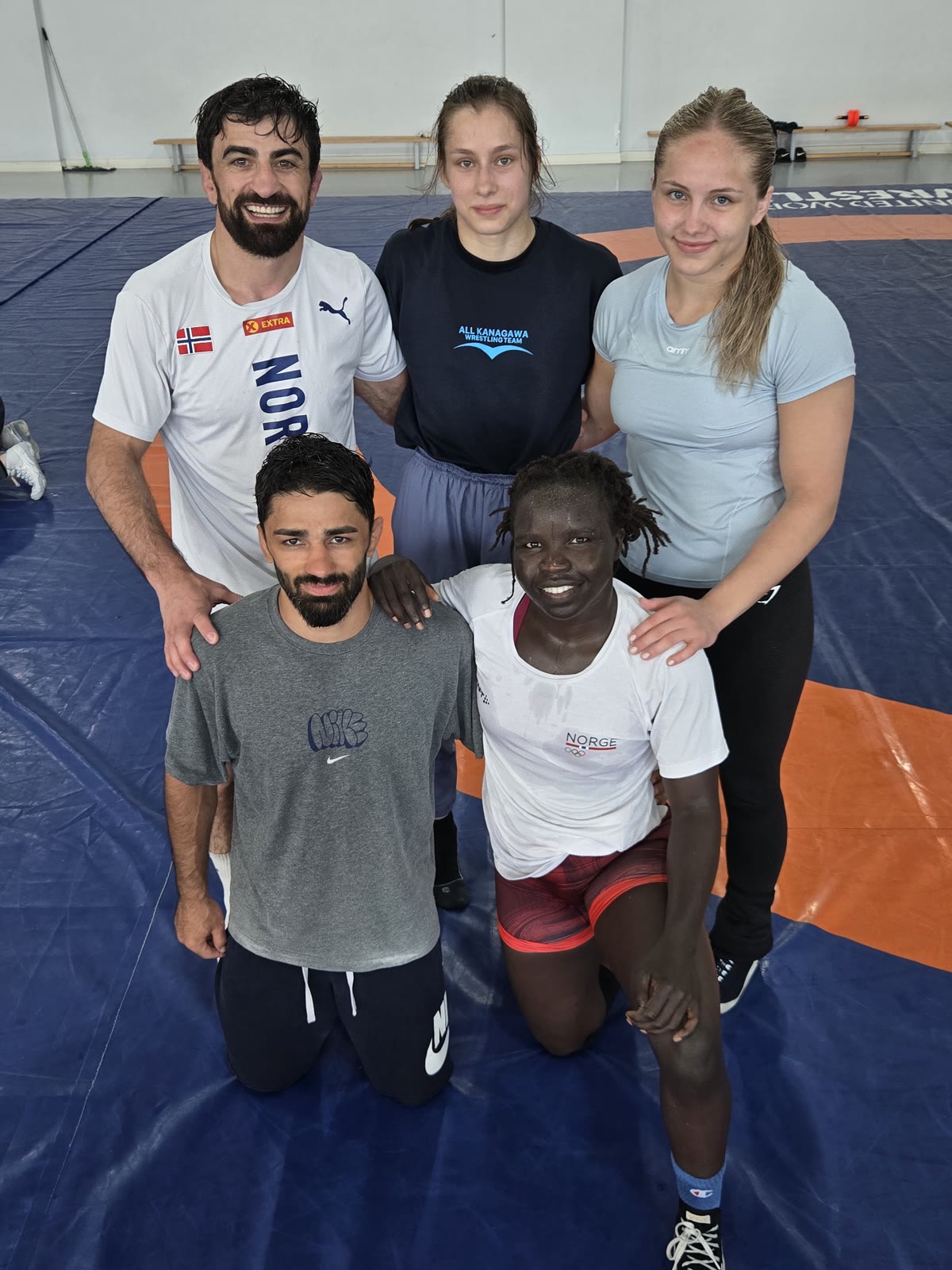 International group of wrestlers from Norway, Japan and Georgia after a session